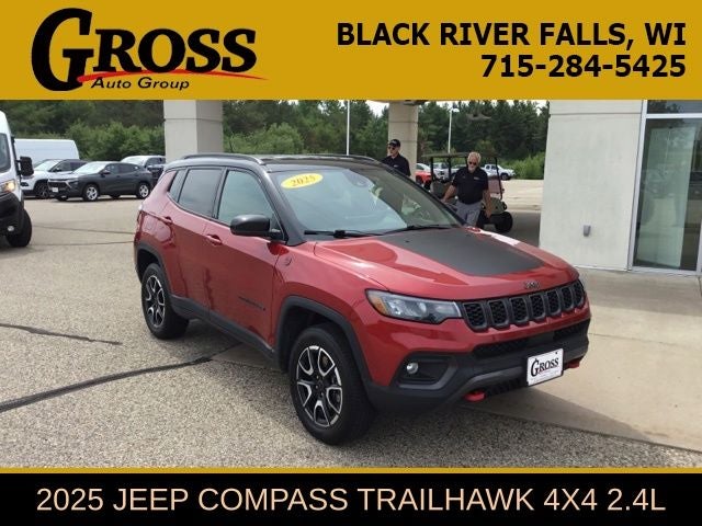 2025 Jeep Compass Trailhawk in Red Hot Pearlcoat — front three-quarter view